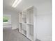 Bright walk-in closet featuring built-in shelving, drawers, and ample storage space at 714 Helms Efird Rd, Marshville, NC 28103