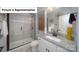 Modern bathroom features sleek vanity, granite countertop, and a glass enclosed shower at 7184 Sylvan Retreat Dr, Denver, NC 28037