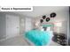 A bedroom with floral wallpaper, a full sized bed, and stylish black nightstands at 7184 Sylvan Retreat Dr, Denver, NC 28037