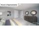 A cozy bedroom with a gray dresser and unique decor at 7184 Sylvan Retreat Dr, Denver, NC 28037