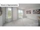 Bright bonus room featuring a glass ping pong table, neutral walls and geometric curtains at 7184 Sylvan Retreat Dr, Denver, NC 28037