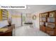 Bright office with a decorative bookcase, desk, and neutral accents at 7184 Sylvan Retreat Dr, Denver, NC 28037