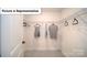 Spacious walk-in closet featuring ample shelving and clothing racks, providing lots of storage space at 7184 Sylvan Retreat Dr, Denver, NC 28037