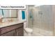 Well-lit bathroom with a glass-enclosed shower, granite countertop, and modern fixtures at 7196 Sylvan Retreat Dr, Denver, NC 28037