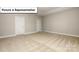 Unfurnished bedroom with neutral carpet, walls, base trim, and two entry doors at 7196 Sylvan Retreat Dr, Denver, NC 28037