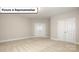 Spacious unfurnished bedroom with neutral carpet and two entry doors at 7196 Sylvan Retreat Dr, Denver, NC 28037