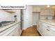 Modern kitchen with stainless steel appliances and granite counters at 7196 Sylvan Retreat Dr, Denver, NC 28037