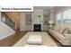 Spacious living room features a fireplace with shelving, lots of light, and an open floor plan at 7196 Sylvan Retreat Dr, Denver, NC 28037