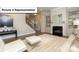 Comfortable living room featuring a fireplace, built-in shelving, and plush carpeting at 7196 Sylvan Retreat Dr, Denver, NC 28037