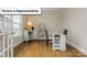 Bright office space with hardwood floors, a window with blinds, and white furniture at 7196 Sylvan Retreat Dr, Denver, NC 28037