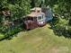 Stunning two-story home with a beautiful deck overlooking a spacious, well-manicured lawn at 7356 Terrace Dr, Charlotte, NC 28211