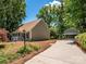 Charming single-Gathering home with a well-maintained lawn and detached garage, showcasing curb appeal at 7356 Terrace Dr, Charlotte, NC 28211