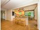 Open-concept kitchen with granite countertops, a breakfast bar, and views to dining area at 7356 Terrace Dr, Charlotte, NC 28211