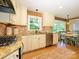 Bright kitchen with stainless steel appliances, granite countertops, and ample cabinet space at 7356 Terrace Dr, Charlotte, NC 28211