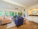 Bright sunroom with sliding doors to outdoor deck and convenient wet bar at 7356 Terrace Dr, Charlotte, NC 28211