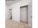 Carpeted bedroom with closet and doorway at 7905 Old Brook Rd, Sherrills Ford, NC 28673