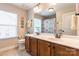 Modern bathroom featuring double sink vanity, large mirror, and natural light at 85017 Newloch Ct, Lancaster, SC 29720