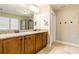 Lovely bathroom with double vanity, warm paint and tiled floors at 85017 Newloch Ct, Lancaster, SC 29720
