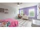 Bright room featuring light walls, two windows, and matching rug and bed accessories at 85017 Newloch Ct, Lancaster, SC 29720