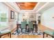 Elegant dining room with hardwood floors, a decorative ceiling, and stylish furnishings for formal dining at 85017 Newloch Ct, Lancaster, SC 29720