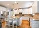 Bright kitchen with granite countertops, stainless steel appliances, and a central island with seating at 85017 Newloch Ct, Lancaster, SC 29720