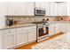 Modern kitchen features stainless steel oven and range and plenty of countertop space at 85017 Newloch Ct, Lancaster, SC 29720