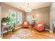 Cozy living room featuring hardwood floors, a decorative rug, and comfortable seating with natural light at 85017 Newloch Ct, Lancaster, SC 29720