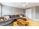 Comfortable living room with a cozy sectional sofa and a geometric yellow rug at 85017 Newloch Ct, Lancaster, SC 29720