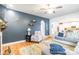 Stylish living room boasts hardwood floors, modern decor, and seamless flow to the open kitchen at 85017 Newloch Ct, Lancaster, SC 29720