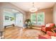 Inviting living room with hardwood floors, natural light, and a view of the entryway and seating area at 85017 Newloch Ct, Lancaster, SC 29720