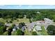 Scenic aerial view of the property, highlighting its location near lush trees and businesses at 921 W 1St St, Lowell, NC 28098