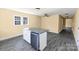 Eat-in kitchen featuring a kitchen island with granite countertop at 921 W 1St St, Lowell, NC 28098