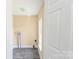 A laundry room with a window and hook ups for a washer and dryer at 921 W 1St St, Lowell, NC 28098