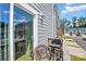 A balcony featuring a grill, wicker chair and views of the neighborhood at 1015 Maltby St, Charlotte, NC 28217