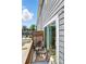 A balcony featuring two wicker chairs and a glass table at 1015 Maltby St, Charlotte, NC 28217