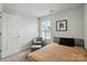 Comfortable bedroom with natural light, neutral tones, and an accent chair at 1015 Maltby St, Charlotte, NC 28217