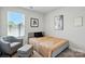 Cozy bedroom with natural light, neutral tones, and modern decor at 1015 Maltby St, Charlotte, NC 28217