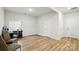 This bonus room features laminate floors, neutral tones and lots of natural light at 1015 Maltby St, Charlotte, NC 28217