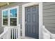 Close-up of a stylish front door with a modern keypad entry and decorative window at 1015 Maltby St, Charlotte, NC 28217