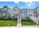 Charming townhome with inviting front entrance, featuring well-manicured landscaping at 1015 Maltby St, Charlotte, NC 28217