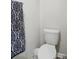 Clean half bathroom features a toilet and a patterned towel at 1015 Maltby St, Charlotte, NC 28217
