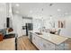 Bright kitchen with white cabinets, granite countertops, stainless steel appliances, an island, and an adjacent dining area at 1015 Maltby St, Charlotte, NC 28217