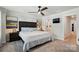 Bright bedroom with decorative lamps, wall art, and access to the ensuite bathroom at 1015 Maltby St, Charlotte, NC 28217