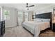Comfortable bedroom with natural light and a decorative headboard at 1015 Maltby St, Charlotte, NC 28217