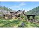 Spacious backyard featuring lush lawn, landscaped garden beds, and an inviting outdoor living area at 102 Antioch Plantation Dr # 18, Matthews, NC 28104