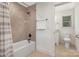 Well-lit bathroom with tile shower and separate vanity area, offering convenience and style at 102 Antioch Plantation Dr # 18, Matthews, NC 28104