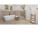 Spa-like bathroom with a soaking tub, tiled shower, and luxurious fixtures at 102 Antioch Plantation Dr # 18, Matthews, NC 28104