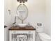Charming half-bathroom featuring a vessel sink and decorative mirror at 102 Antioch Plantation Dr # 18, Matthews, NC 28104