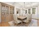 Formal dining room with coffered ceiling, elegant chandelier, and built-in china cabinet at 102 Antioch Plantation Dr # 18, Matthews, NC 28104