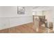 Bright hallway with hardwood floors and staircase leading to upper level, providing an open and airy feel at 102 Antioch Plantation Dr # 18, Matthews, NC 28104